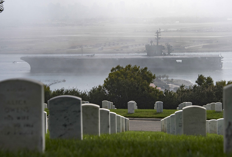 USS Theodore Roosevelt (CVN 71) passes Fort Rosecrans National Cemetery as it returns to Naval Air Station North Island.